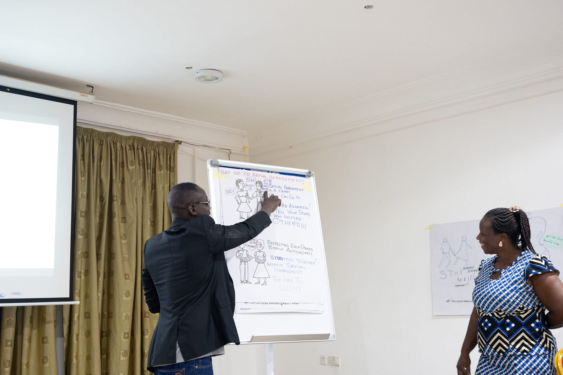 Participant presenting during a workshop in Ghana.