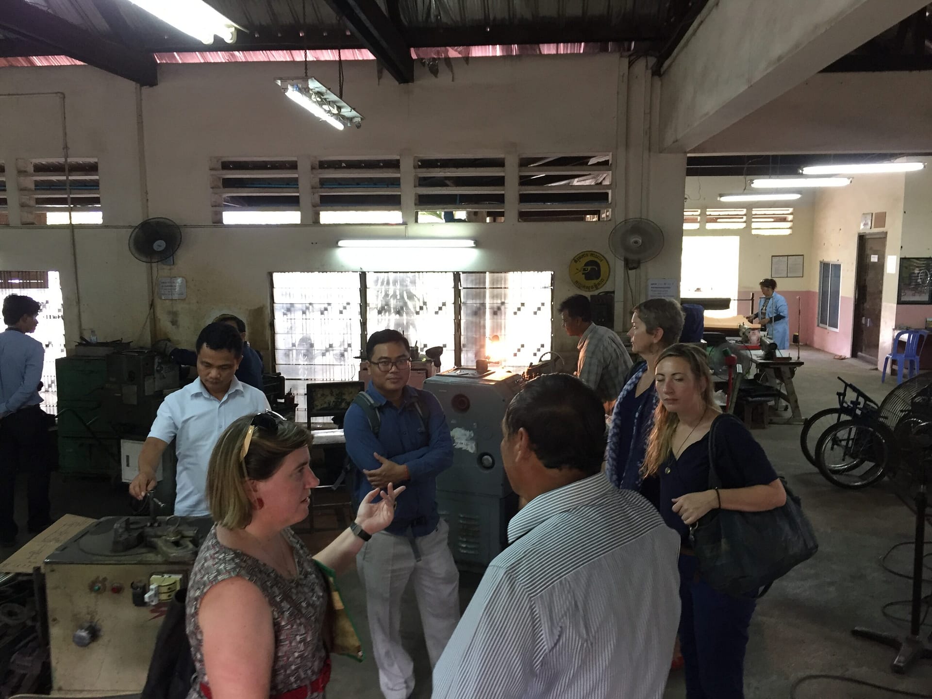 Visting a wheelchair workshop in Phnom Penh, Cambodia.